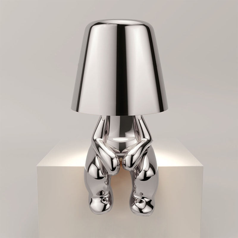 The Thinking Man's Little Golden Man Table Lamp: Lighting Up Creative Inspiration