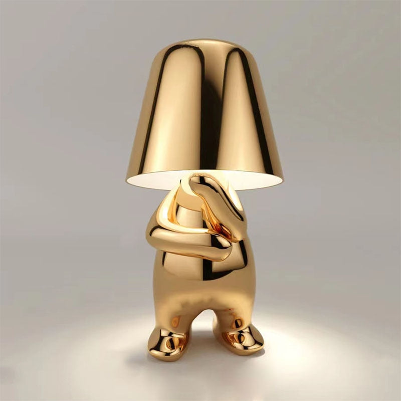 The Thinking Man's Little Golden Man Table Lamp: Lighting Up Creative Inspiration